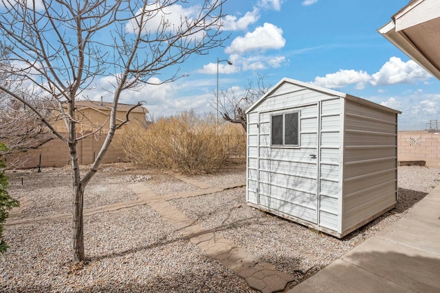 view of shed featuring a fenced backyard