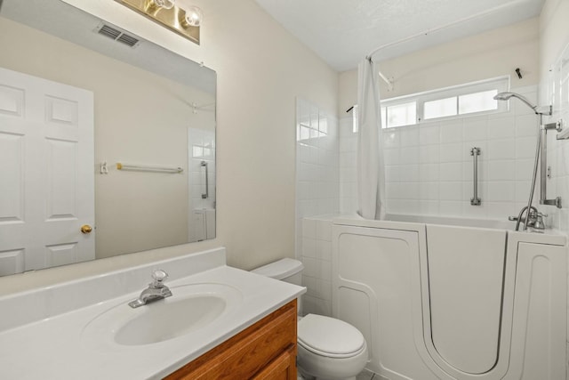 full bath with toilet, vanity, visible vents, and shower / bathtub combination with curtain