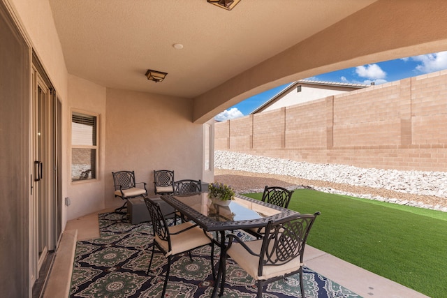 view of patio / terrace featuring outdoor dining area and a fenced backyard