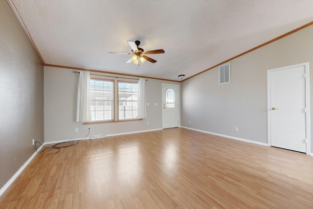 unfurnished living room with light wood-type flooring, visible vents, ceiling fan, and a textured ceiling