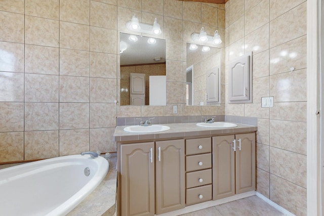 full bathroom featuring a sink, tile walls, and double vanity