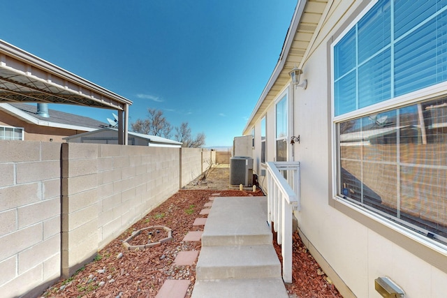 view of yard featuring cooling unit and a fenced backyard