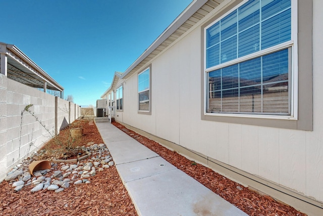 view of side of property with fence