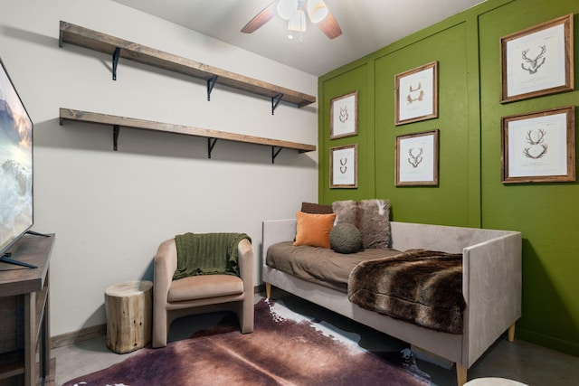 1800 Los Pinos Rd, Bosque Farms, NM 87068 - living area featuring a ceiling fan, baseboards, and concrete flooring