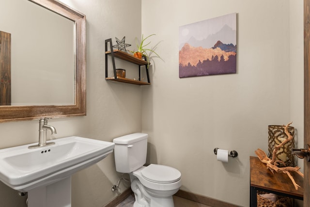 1800 Los Pinos Rd, Bosque Farms, NM 87068 - half bath with toilet, a sink, and baseboards