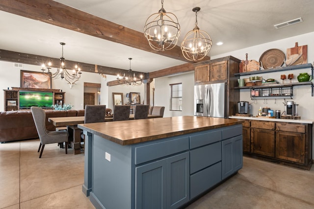 1800 Los Pinos Rd, Bosque Farms, NM 87068 - kitchen featuring a chandelier, stainless steel fridge with ice dispenser, wood counters, concrete flooring, and beamed ceiling