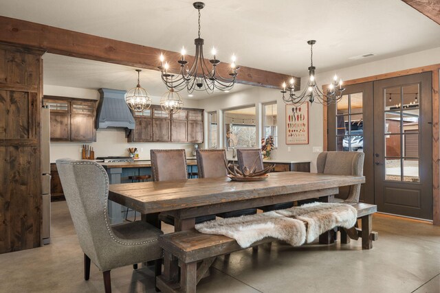 1800 Los Pinos Rd, Bosque Farms, NM 87068 - dining space with a chandelier, concrete floors, beam ceiling, and french doors