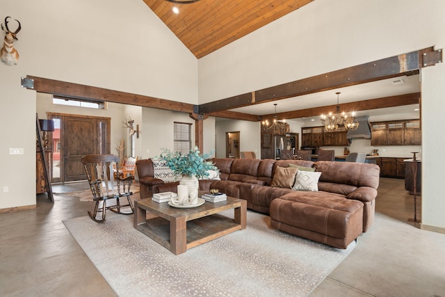 1800 Los Pinos Rd, Bosque Farms, NM 87068 - living area with a chandelier, concrete floors, high vaulted ceiling, wooden ceiling, and baseboards