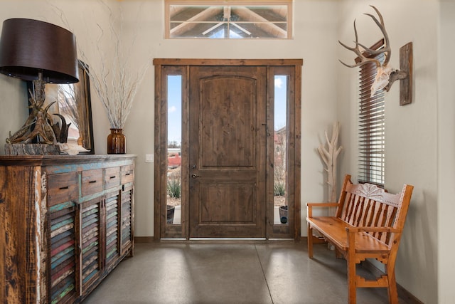 1800 Los Pinos Rd, Bosque Farms, NM 87068 - foyer entrance with concrete flooring and baseboards