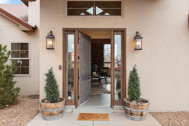 doorway to property with stucco siding