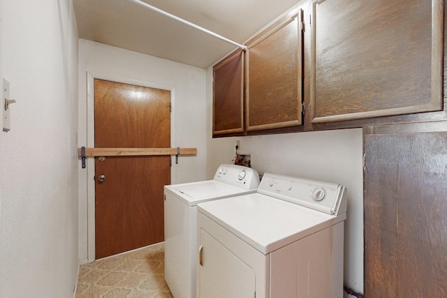 laundry area with washer and dryer and cabinet space