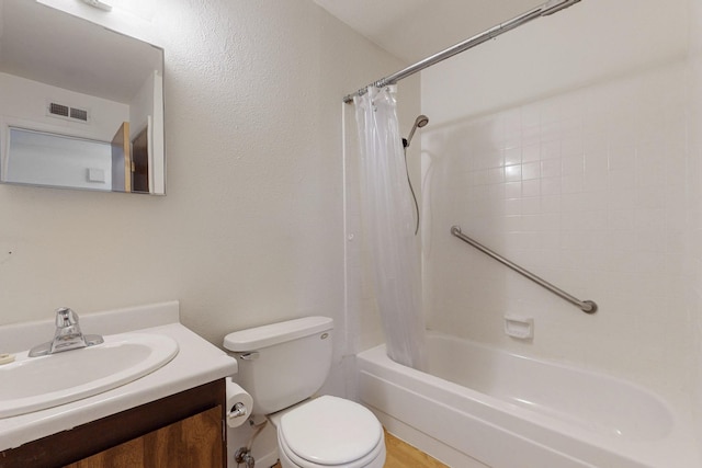 bathroom with toilet, shower / tub combo, visible vents, and vanity