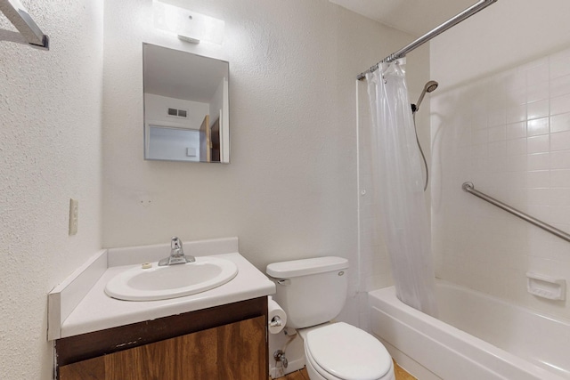 full bath featuring a textured wall, toilet, shower / tub combo, vanity, and visible vents