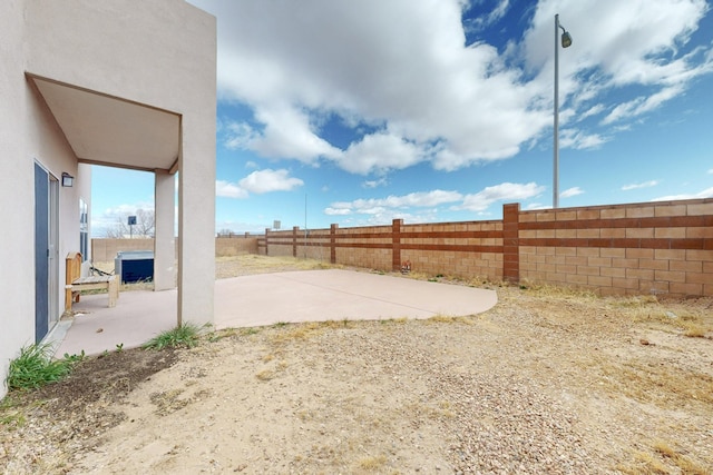 view of yard with a patio area and fence