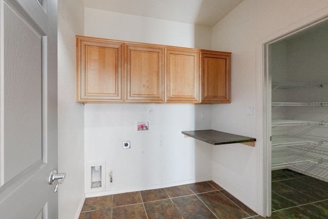 laundry room with washer hookup, cabinet space, electric dryer hookup, and hookup for a gas dryer