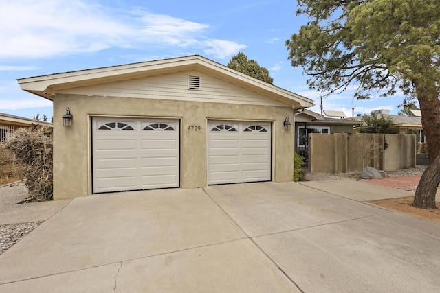 garage with fence