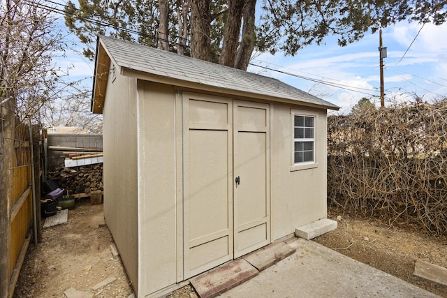 view of shed featuring a fenced backyard