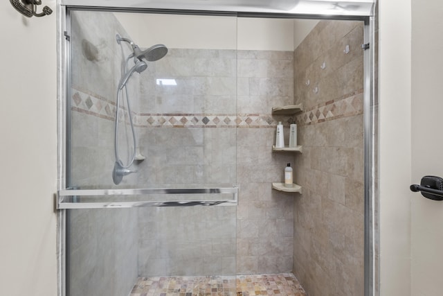 full bathroom featuring a shower stall