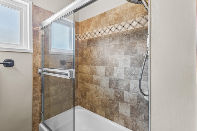 full bathroom featuring bath / shower combo with glass door