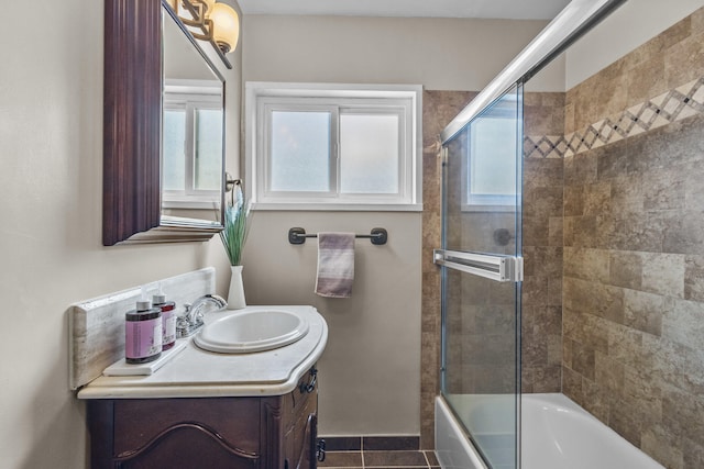 full bathroom featuring tile patterned floors, enclosed tub / shower combo, and vanity