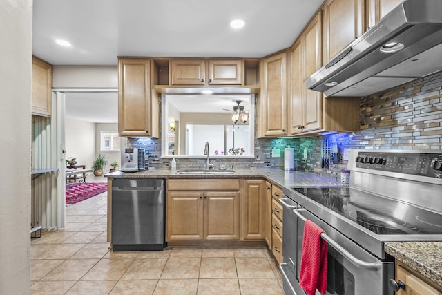 kitchen with light tile patterned floors, tasteful backsplash, stainless steel appliances, a sink, and exhaust hood