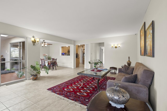 living room featuring visible vents and light tile patterned floors