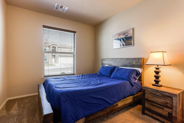 bedroom featuring carpet, visible vents, and baseboards