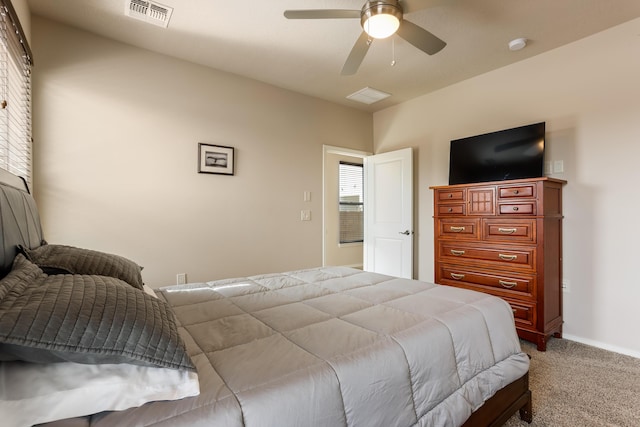 bedroom with carpet floors, ceiling fan, visible vents, and baseboards