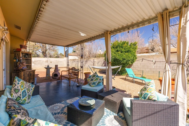 view of patio featuring outdoor lounge area, outdoor dining space, a fenced backyard, and visible vents