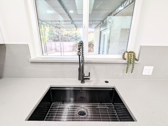 room details with light countertops and a sink