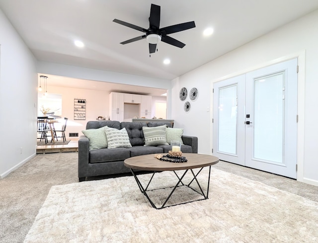 living room with recessed lighting, french doors, light carpet, and ceiling fan