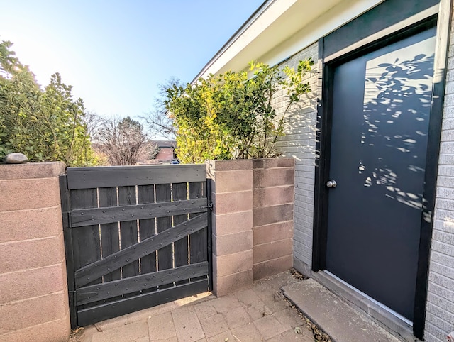 view of exterior entry featuring a gate