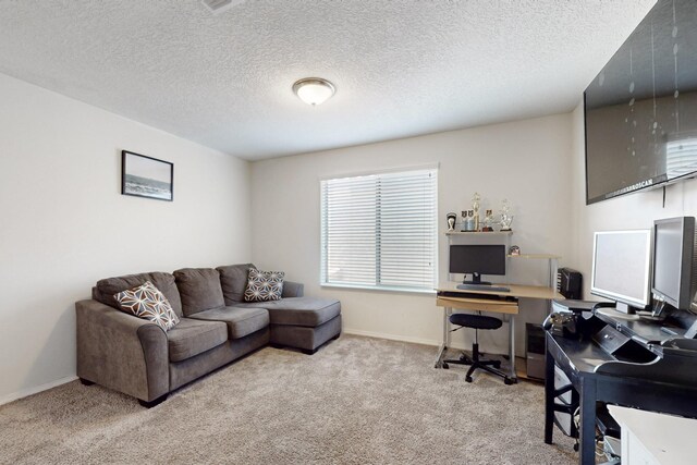 home office with baseboards, carpet floors, and a textured ceiling