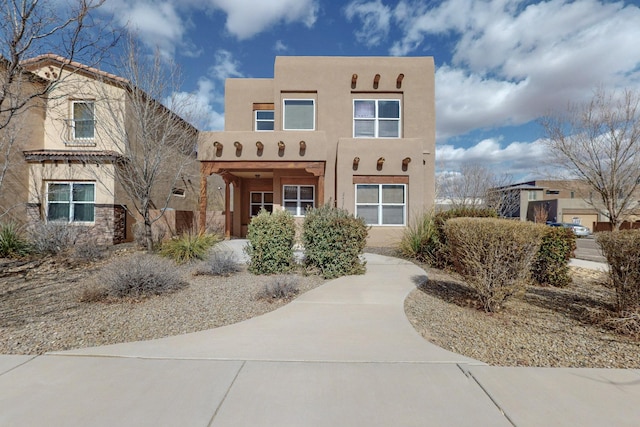 adobe home with stucco siding