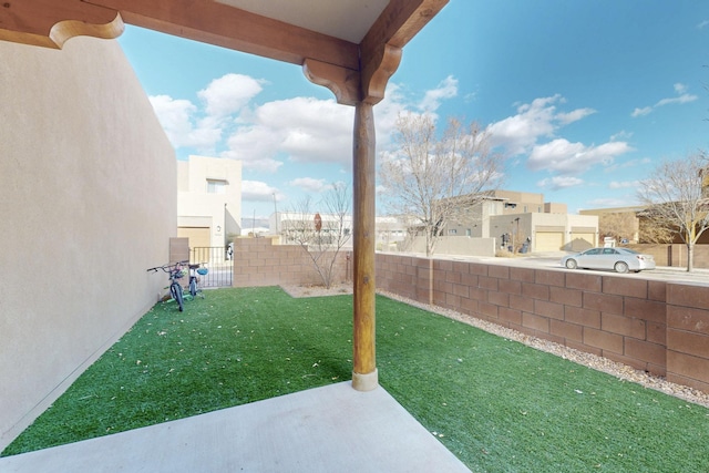 view of yard with a patio area and fence