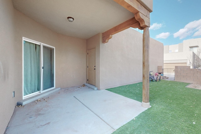 view of patio / terrace featuring fence