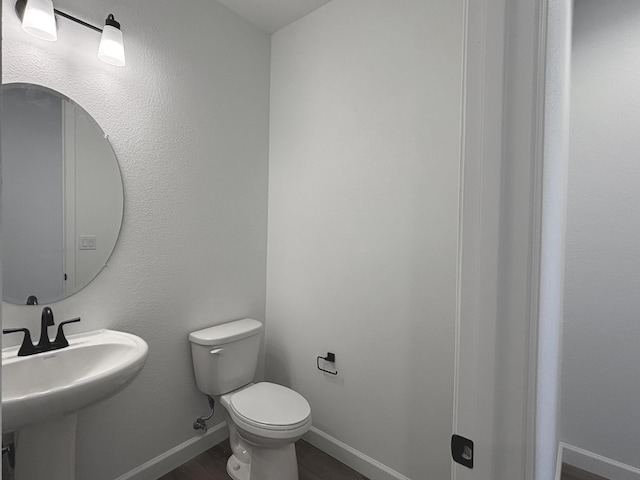 3340 Wolf Tail Loop NE, Rio Rancho, NM 87144 - half bathroom featuring toilet and wood finished floors