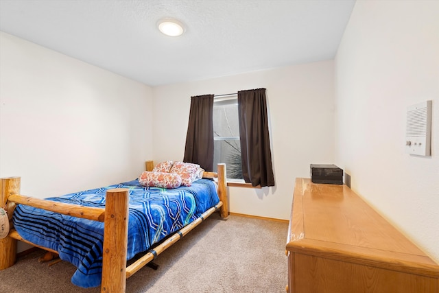 bedroom with carpet flooring and baseboards