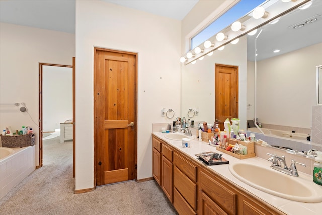 full bathroom with a bath, a sink, and carpet flooring