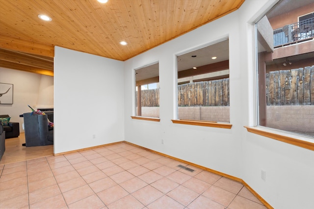 spare room featuring light tile patterned floors, baseboards, visible vents, wooden ceiling, and recessed lighting