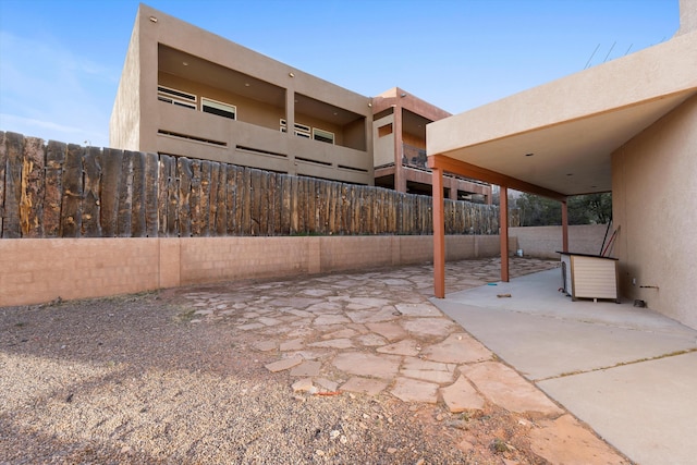 view of patio / terrace featuring fence