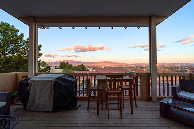 deck featuring a mountain view and grilling area