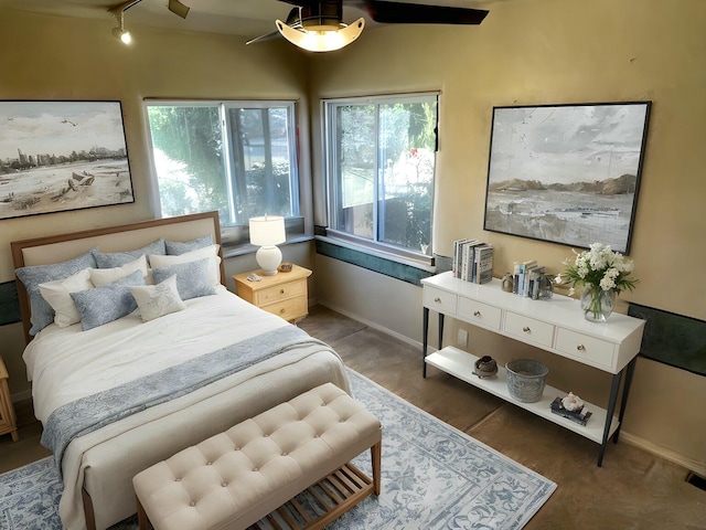 627 Fairway Rd NW, Albuquerque, NM 87107 - bedroom with baseboards and rail lighting