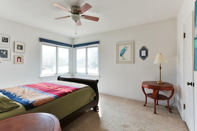 627 Fairway Rd NW, Albuquerque, NM 87107 - bedroom with light colored carpet and ceiling fan
