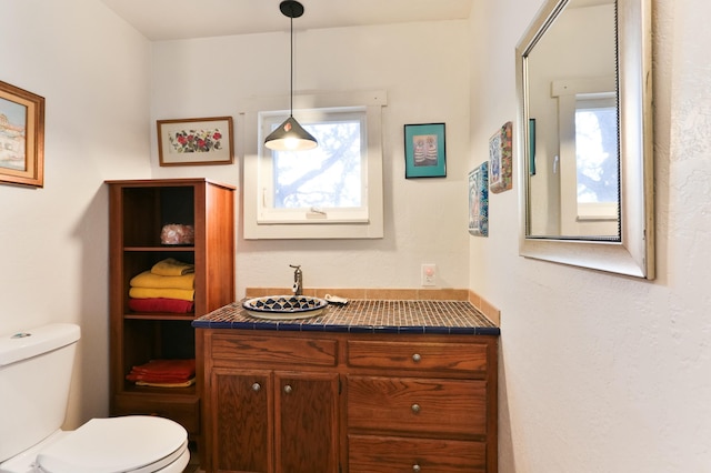 627 Fairway Rd NW, Albuquerque, NM 87107 - bathroom with toilet and a sink