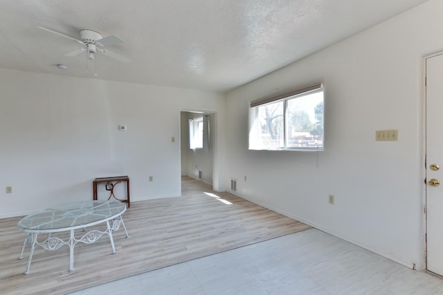 627 Fairway Rd NW, Albuquerque, NM 87107 - spare room featuring ceiling fan, a textured ceiling, and light flooring