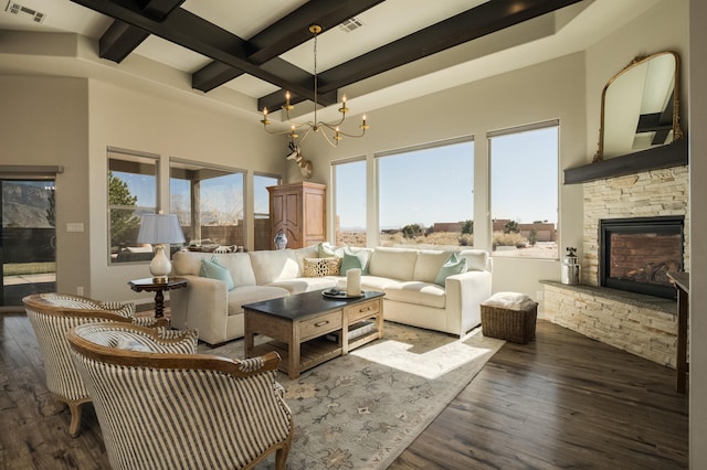 sunroom with a stone fireplace, coffered ceiling, visible vents, beamed ceiling, and an inviting chandelier