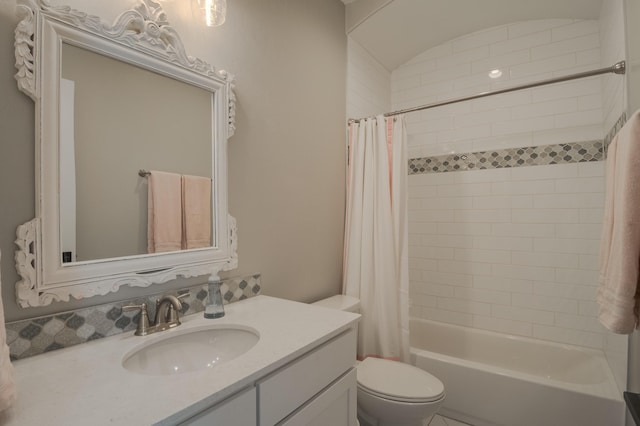 full bath with vanity, toilet, and shower / tub combo with curtain