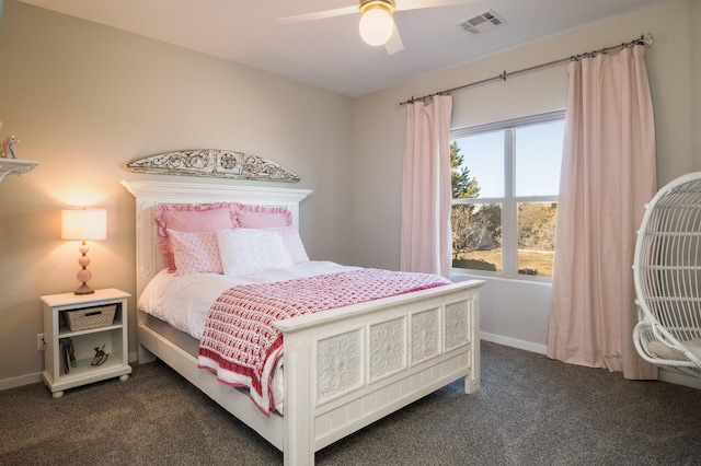 bedroom with dark colored carpet, visible vents, ceiling fan, and baseboards