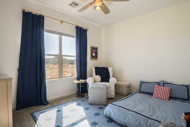 carpeted bedroom with a ceiling fan, visible vents, and baseboards